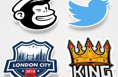 Various shapes and sizes of custom die cut stickers displayed in a professional setting.