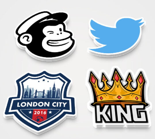 Various shapes and sizes of custom die cut stickers displayed in a professional setting.